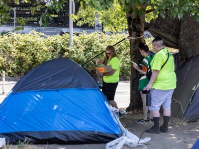 Transition Projects workers conduct outreach to a tent near Old Town Portland