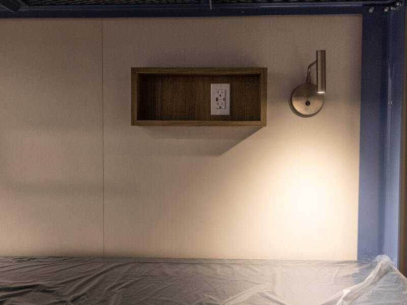 Reading lamp next to a bunk bed