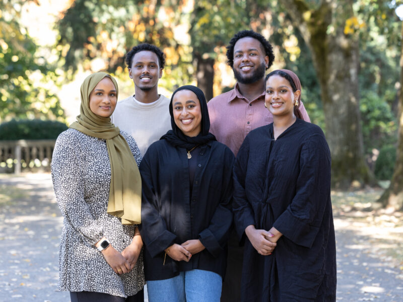 Somali Empowerment Circle housing team stands in a park.